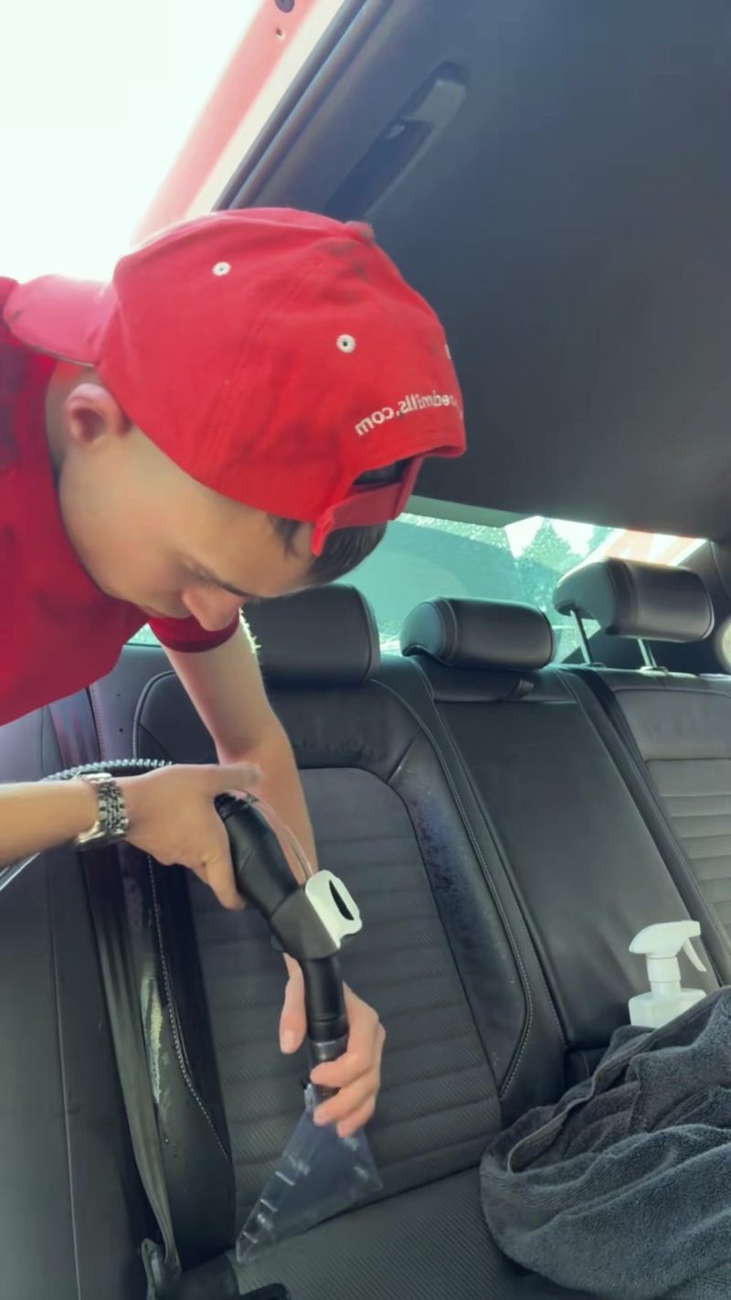 Nestor working inside a car at the unit